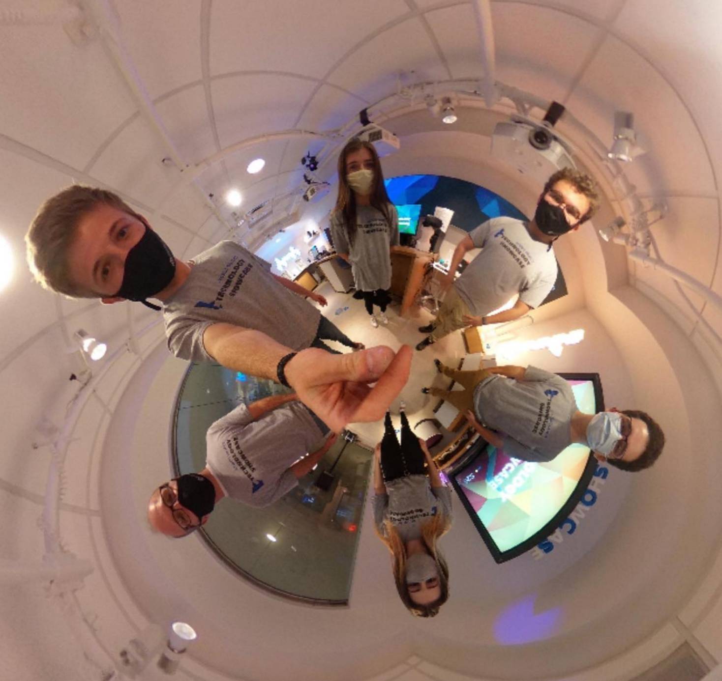 a distorted 360 degree view of the Technology Showcase with students surrounding the image.